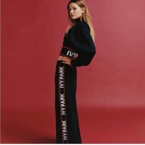 Ivy Park Black with Orange Stripes Trim in White Logo Letters Jacket